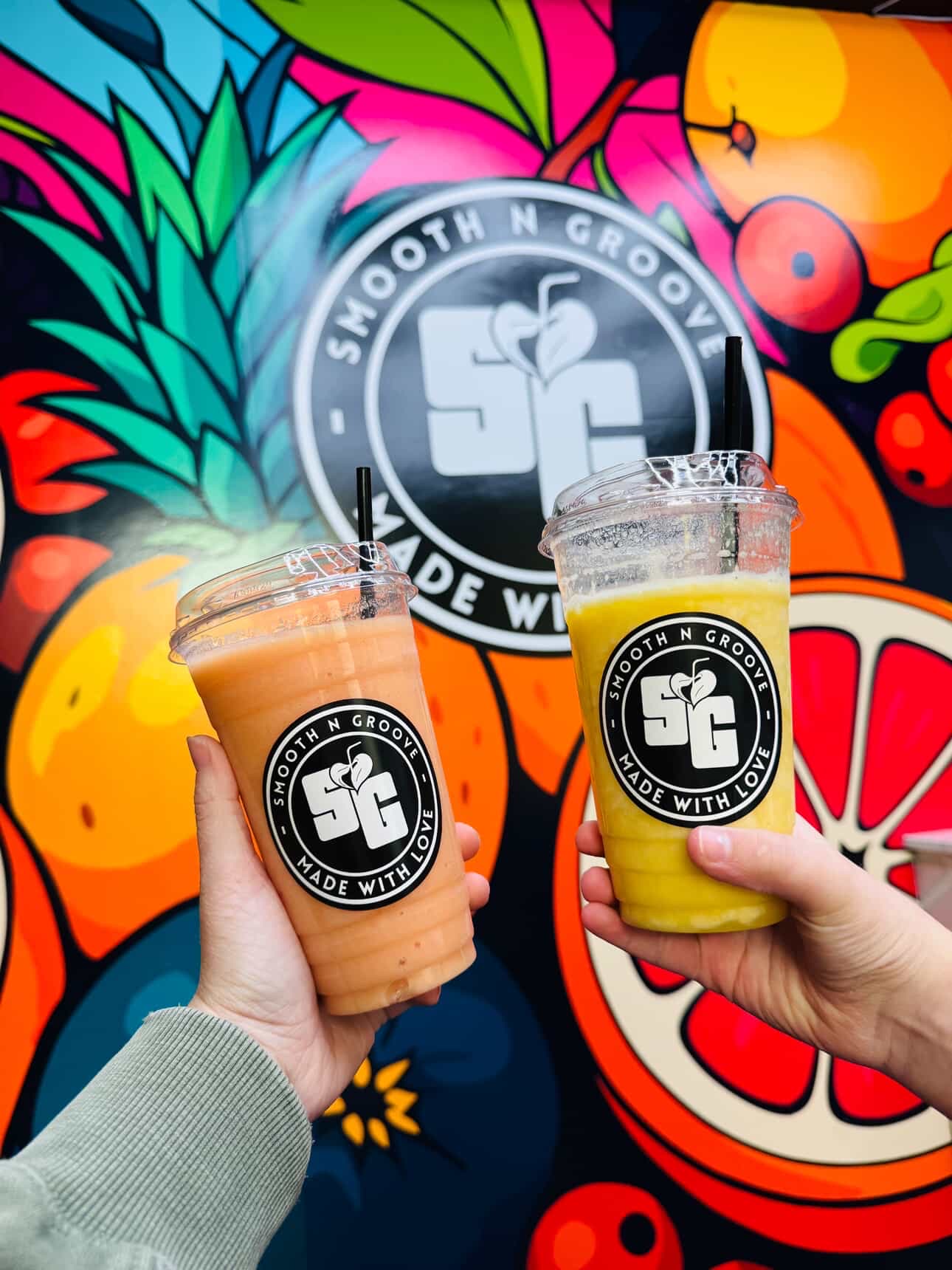 Smoothie cups with colorful mural